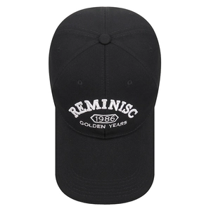 Black cotton baseball cap featuring white 3D embroidery of Reminiscence 1986
