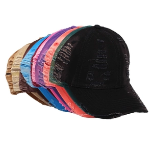 Distressed washed denim baseball caps in multiple colors with vintage ripped details