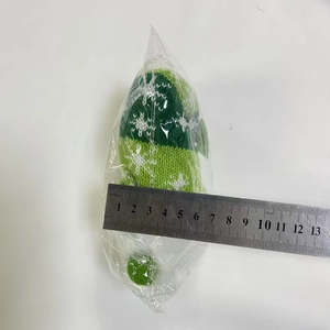 Size measurement of green knitted Christmas ornament with snowflake pattern showing 11cm length