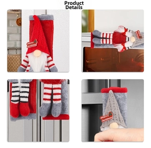 Detail of red and grey knitted Christmas gnome covers for refrigerator door handles