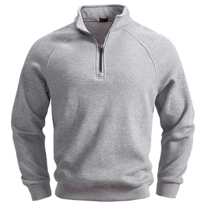 Detail of grey half-zip sweatshirt featuring a stand collar and ribbed knit texture