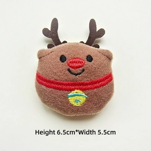 Detail of plush reindeer accessory with embroidery, measuring 6.5cm height by 5.5cm width