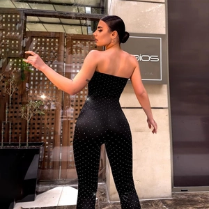 Close-up back view of black strapless jumpsuit with shimmering silver rhinestones detail