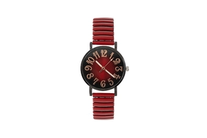 Detail of red gradient dial with bronze numerals and flexible strap on ladies watch