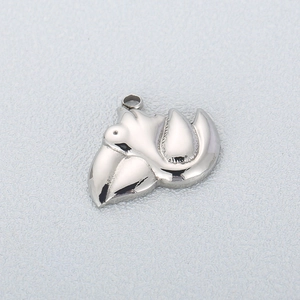 Macro shot of silver stainless steel pelican bird charm for custom necklace jewelry