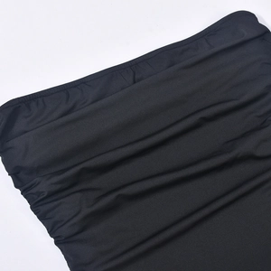 Detailed macro shot of black ruched fabric texture with elastic pleated design details