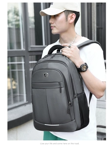 Close-up of the grey business travel backpack with durable nylon fabric and metal logo