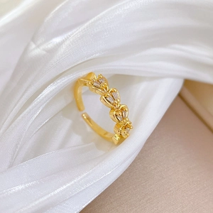 Detail of gold heart-shaped double row eternity ring with sparkling zircon stones
