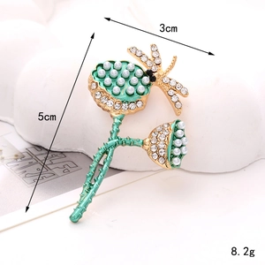 Golden lotus seed pod brooch with green enamel, white pearls and sparkling rhinestones