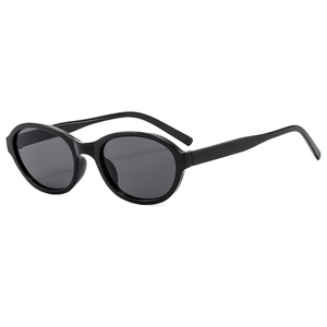 Oval slim sunglasses with black frames and dark grey lenses in a minimalist fashion style