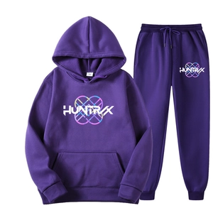 Flat lay of purple Ivan Cornejo hoodie and joggers set with heart logo embroidery