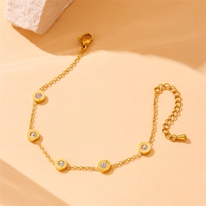 Gold stainless steel chain bracelet with crystal-studded Roman numeral round charms