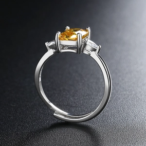 Minimalist silver open ring with rectangular yellow zircon and side diamond accents