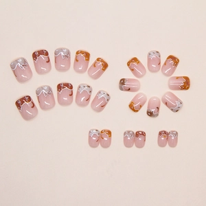 Detail view of 24pcs cute cartoon cat press-on nails in brown and white calico patterns