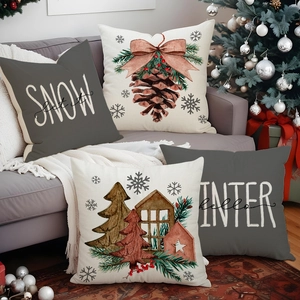 Christmas tree and pinecone linen pillow covers on a sofa in a festive living room