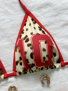 Leopard print halter bikini top with red trim and number ten print detail
