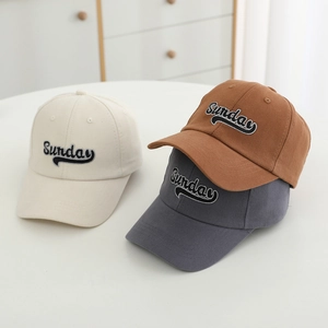 Detailed embroidery of Sunday text on beige, caramel and dark grey baseball caps