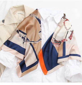 Detail of 90cm silk scarf with chain and equestrian pattern on white shirt