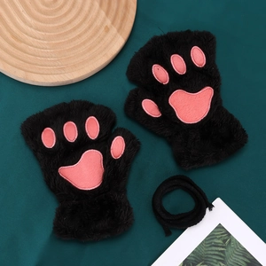 Detail of plush black cat paw fingerless gloves with soft pink embroidery and neck strap