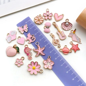 Pink enamel charm set with butterfly and unicorn shapes for DIY jewelry making