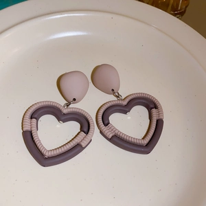 Fashionable matte heart drop earrings with two-tone geometric hollow design and cord texture