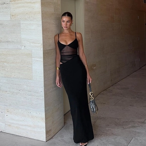 Slim fit black maxi dress with sheer mesh panel and thin straps for elegant evening wear