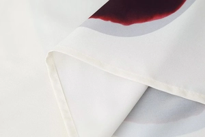Detailed close-up of premium fabric showing color-block patterns and refined stitching