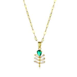 Minimalist gold necklace with branch pendant featuring green and white gemstones