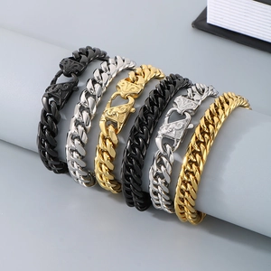 Polished stainless steel Cuban link bracelets in gold, silver, and black with carved clasps