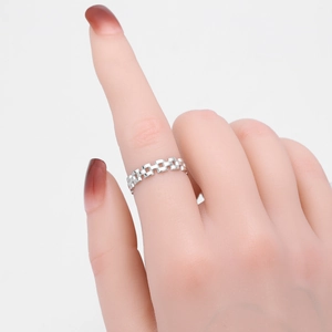Detailed close-up of a vintage s925 sterling silver chain ring with watchband texture