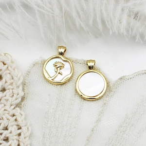 18K gold plated white shell rose flower pendant and round gold charm on lace background