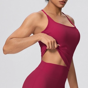 Detailed side view of dark red yoga tank top with thin straps and matching high waist leggings