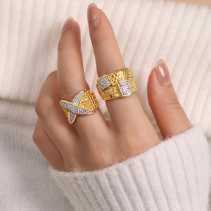 Chic gold-plated titanium steel rings featuring braided texture and cross design with diamonds