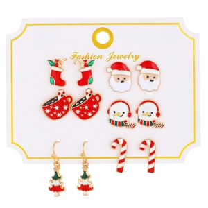Set of six Christmas themed stud earrings featuring Santa, snowman, and tree on display card