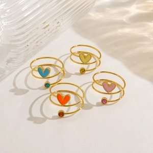 Set of 4 colorful enamel heart spiral rings in gold finish with matching zircons