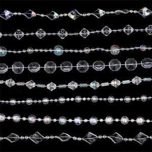 Various acrylic crystal bead chains with multifaceted diamond and sphere shapes on black