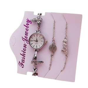 Elegant silver quartz watch set with white dial and decorative charm bracelets