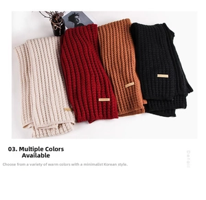 Detail view of chunky knit winter scarves with leather handmade tags in four colors