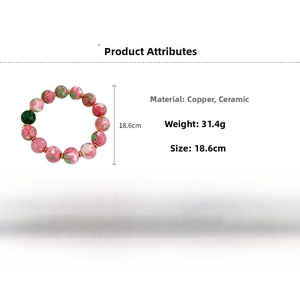 Detail view of floral ceramic beads bracelet with gold-plated copper spacers and size info
