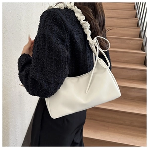 Minimalist white leather shoulder bag with a stylish pleated scrunchie strap detail
