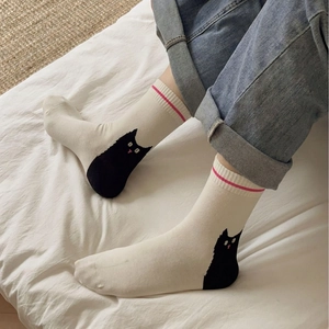 Comfy cream white crew socks with cartoon cat heel illustration and pink stripe detail