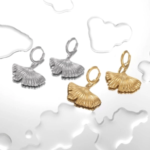Ginkgo leaf earrings in gold and silver finishes, shown from a top-down view