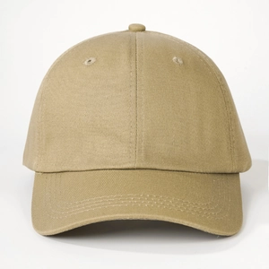 Detail of khaki cotton baseball cap with six-panel design and reinforced brim stitching