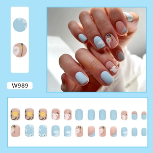 Short matte press-on nails set featuring blue floral and bird patterns in style W989