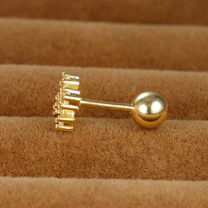 Macro view of gold screw ball back earring with micro-paved cubic zirconia stones