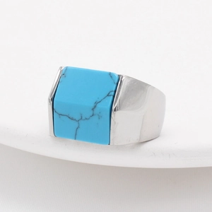 Men's square turquoise ring in silver stainless steel finish on a white background