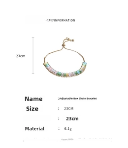 Detail of adjustable gold box chain with rainbow zircon gemstones and sliding bead clasp