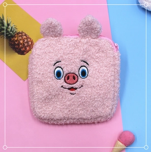 Detailed view of soft pink plush pig pouch with teddy fleece and cute embroidery