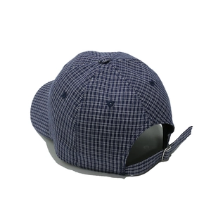 Detail of navy plaid baseball cap showing the adjustable metal buckle and stitching