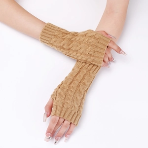 Close-up of camel cable knit arm warmers showing thumb hole and ribbed texture detail